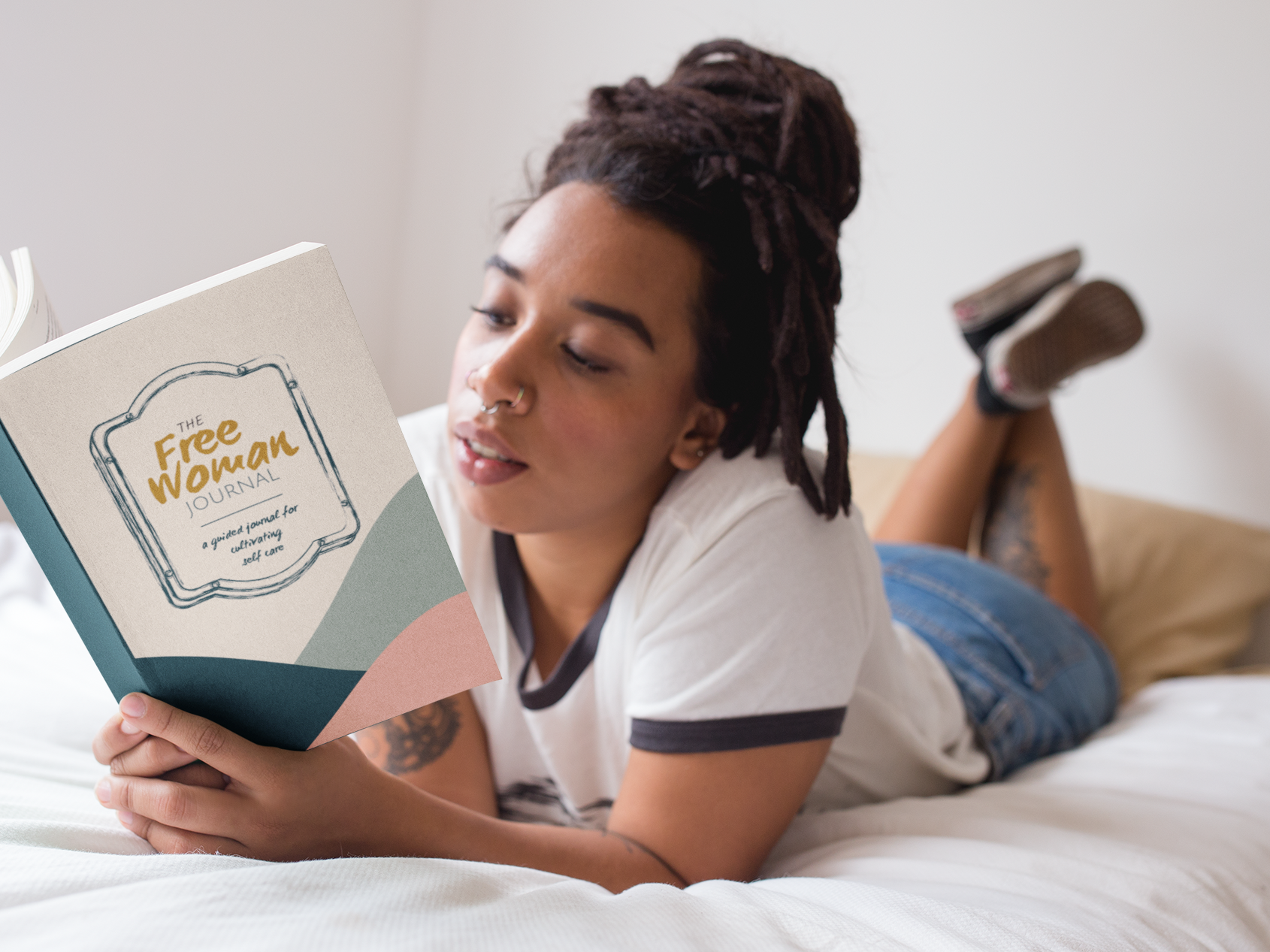 black-girl-with-dreadlocks-reading-a-book-mockup-in-bed-a17302 copy.png