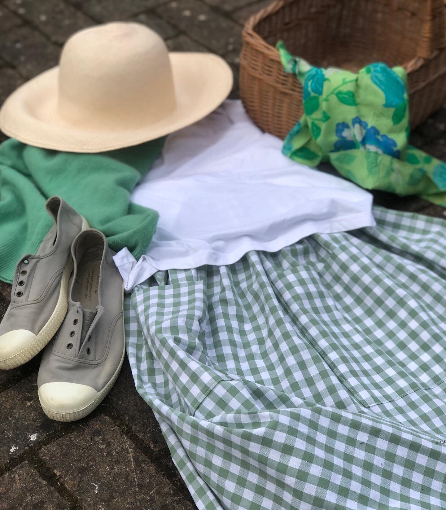 A spring outfit. There&rsquo;s a gingham skirt, a thrifted cashmere sweater, straw hat and old basket, plimsolls and a very special silk scarf that used to belong to my mother 💚 #springoutfit #wearwhatyoulove #thriftedoutfit #ginghamstyle