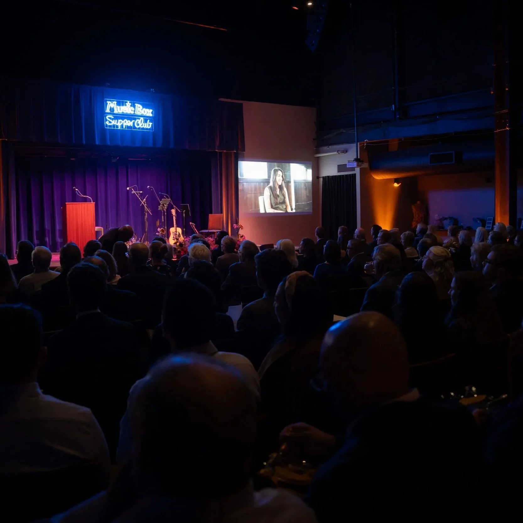 The audience watches a video at the start of Renovare's 2025 Concert Gala.