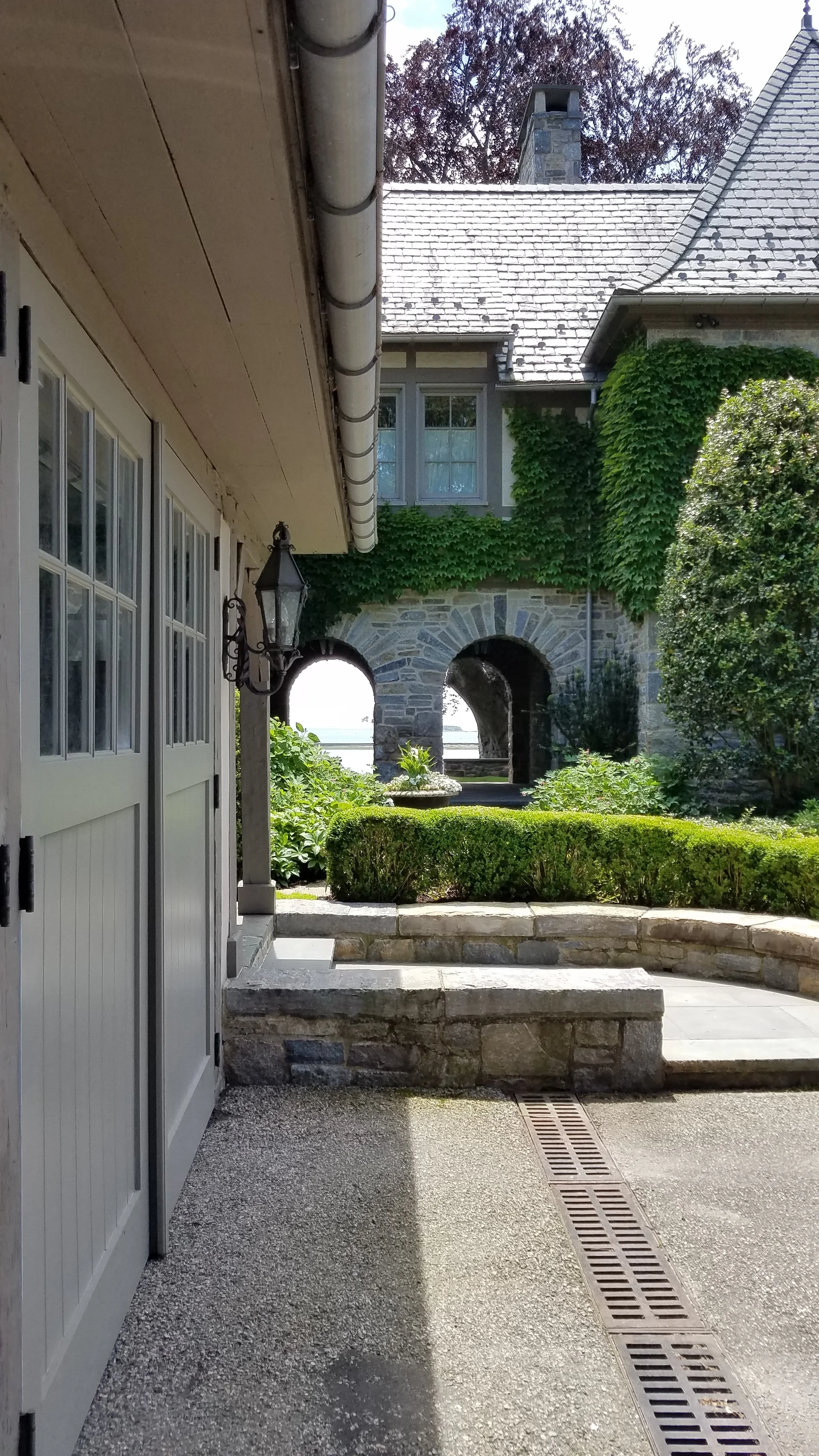 The beautiful view greets you as you arrive. That is the Long Island Sound seen through the arched breezeway.
