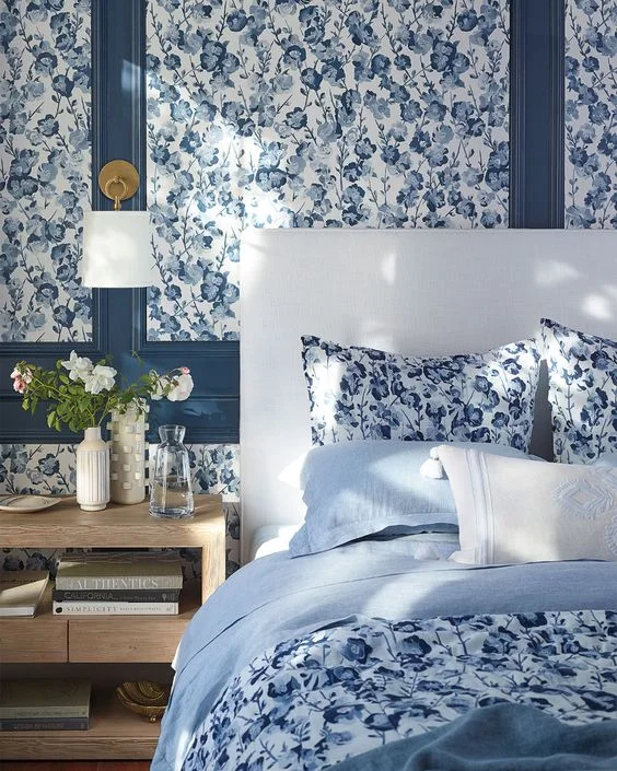 Beautiful bedroom with blue lacquer trim. Serena and Lily wallpaper.