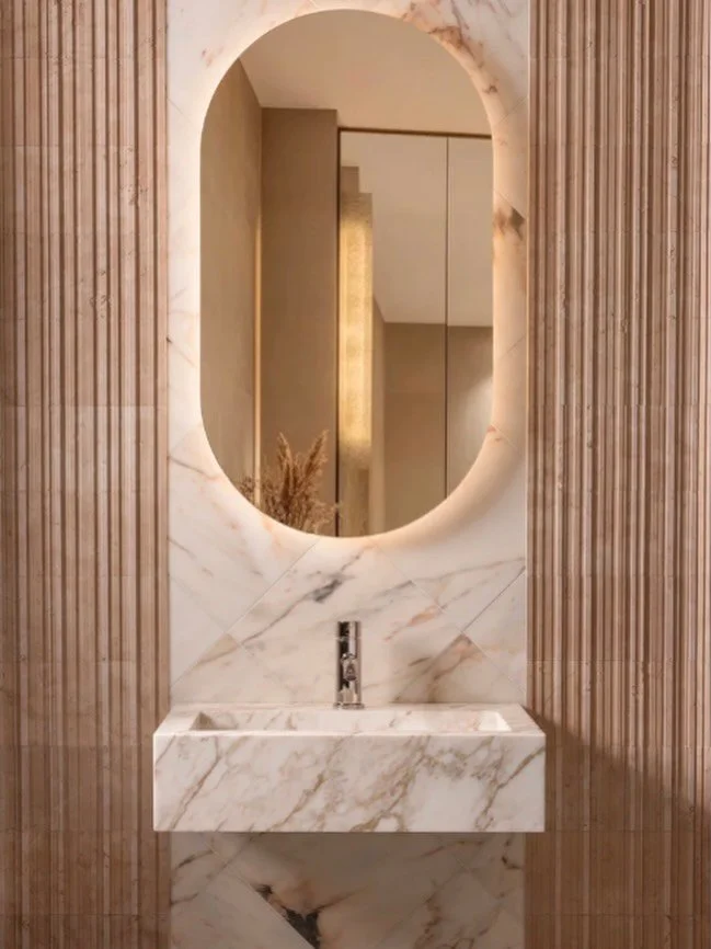 We have new stone samples in the showroom. Oro Vecchio . Shown here- custom floating sink, carved from Oro Vecchio Marble, serves as the ultimate focal point. Its creamy white base is brought to life by sweeping veins of pink and gold&mdash;tones tha