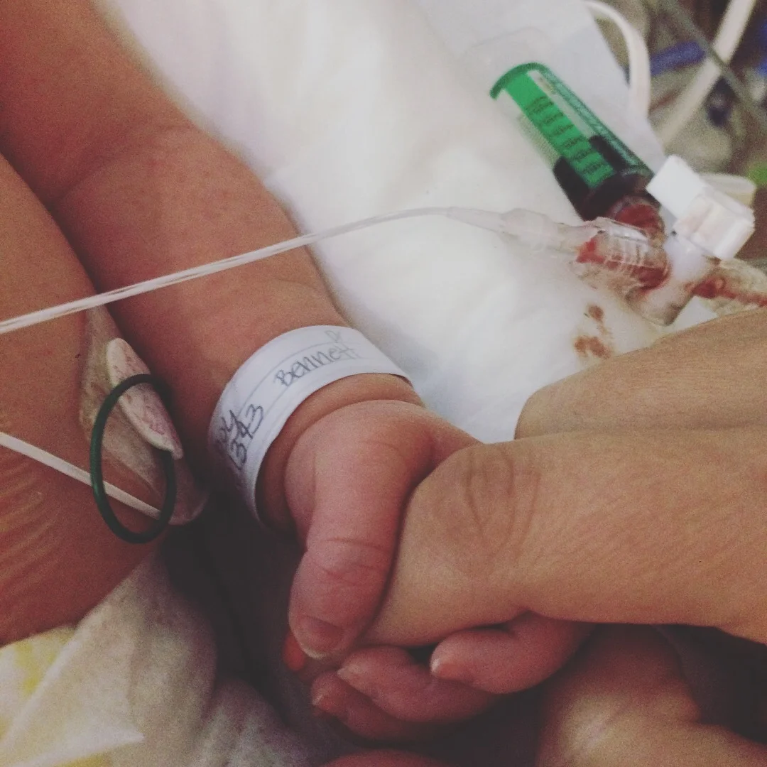 Harvey holding my hand in the NICU