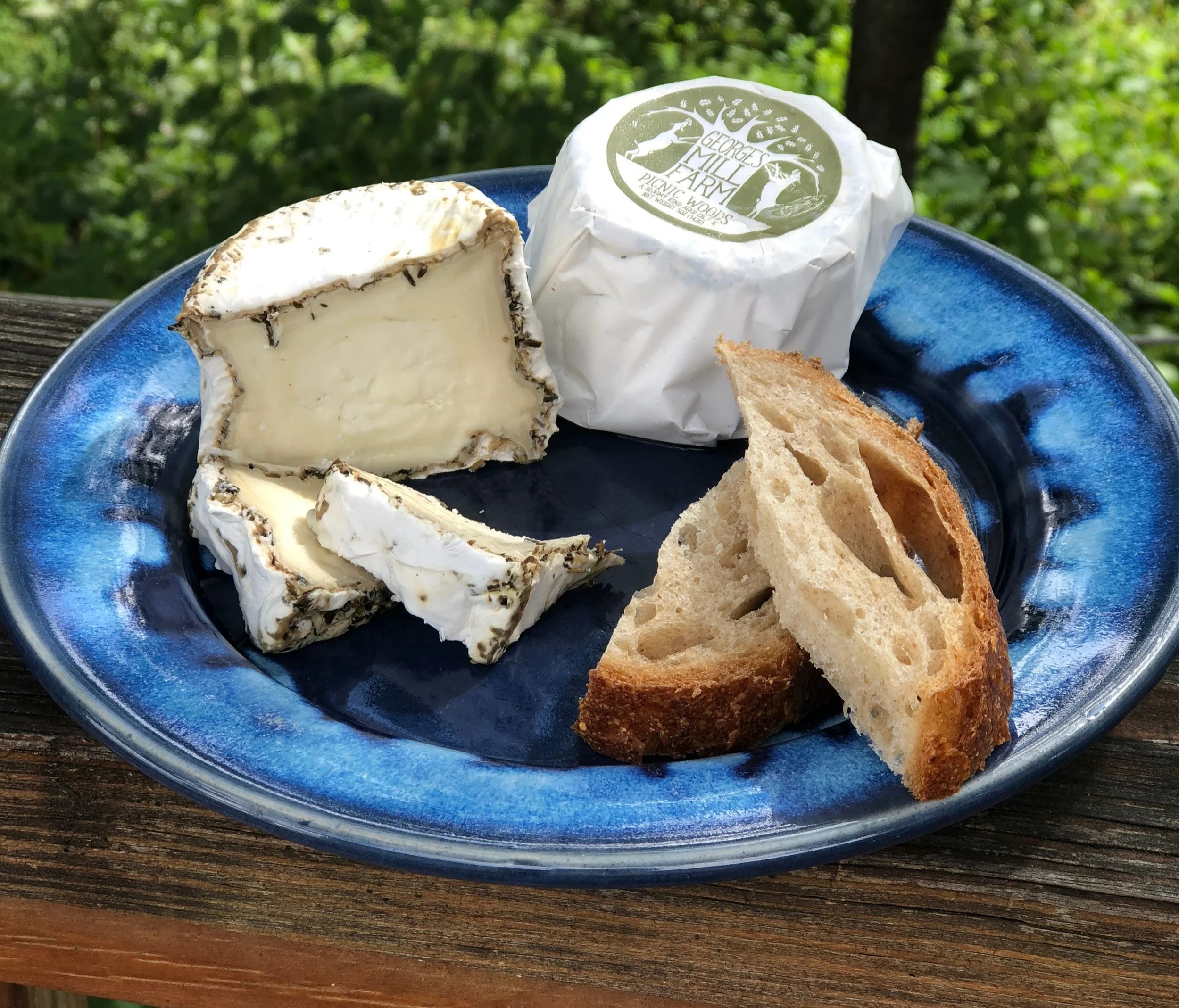Picnic Woods , our herbed bloomy rind, rolled in herbs de provence and aged 2-8 weeks during which it changes from firm and herbacious to soft and earthy.