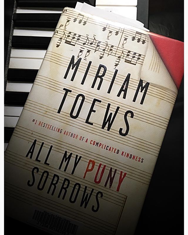 #reading this weekend, against the sturm und drang of thunderstorms and the threat of candlelight. #rainyday #rainydayreading #amreading #canlit #readers #readersofinstagram #musiciansofinstagram #musicians #miriamtoews #allmypunysorrows #piano