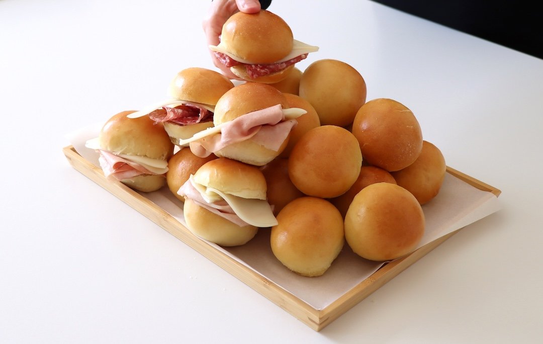 Italian bread rolls, filled with ham, cheese and salami.