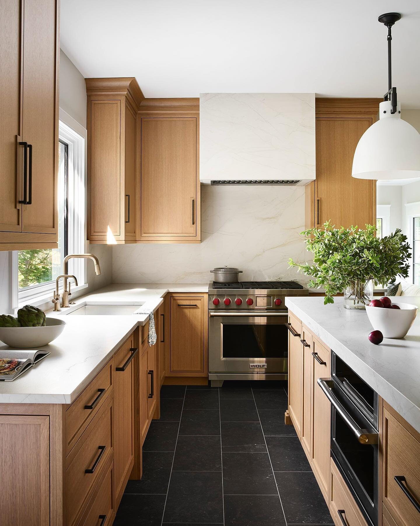 Sharing a Before and After kitchen renovation: we combined the breakfast room and kitchen, tiled the floors with heat to keep feet warm, and kept the palette warm, but simple. Appliances are hidden where necessary to highlight the white oak  cabinetr