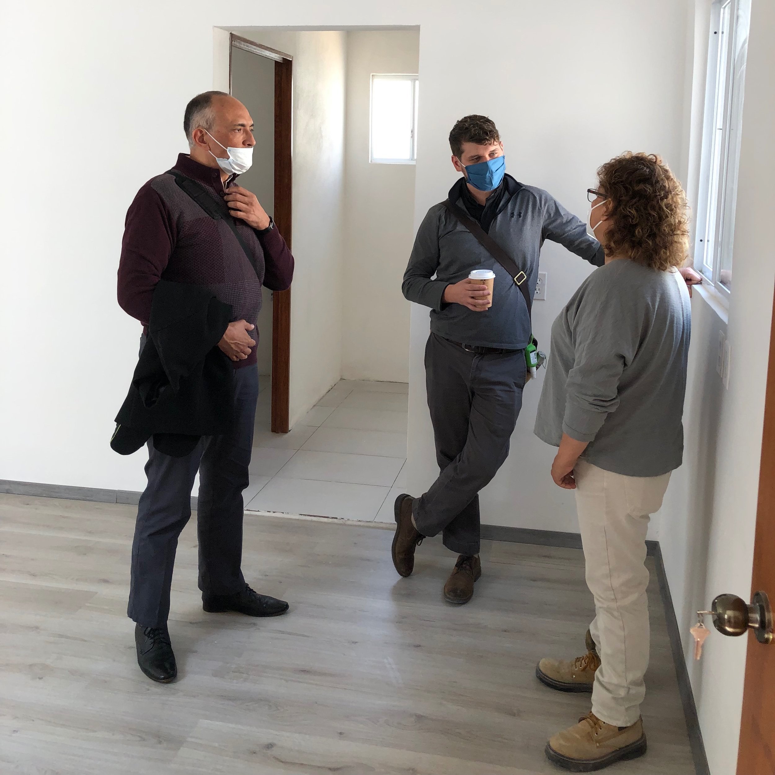  Rev. Roberto Federico Trejo Haager, Pastor President of the Iglesia Luterana Mexicana, talks with Michael Busbey, ELCA Regional Representative for Mexico and Central America, and the architect working on the house. 