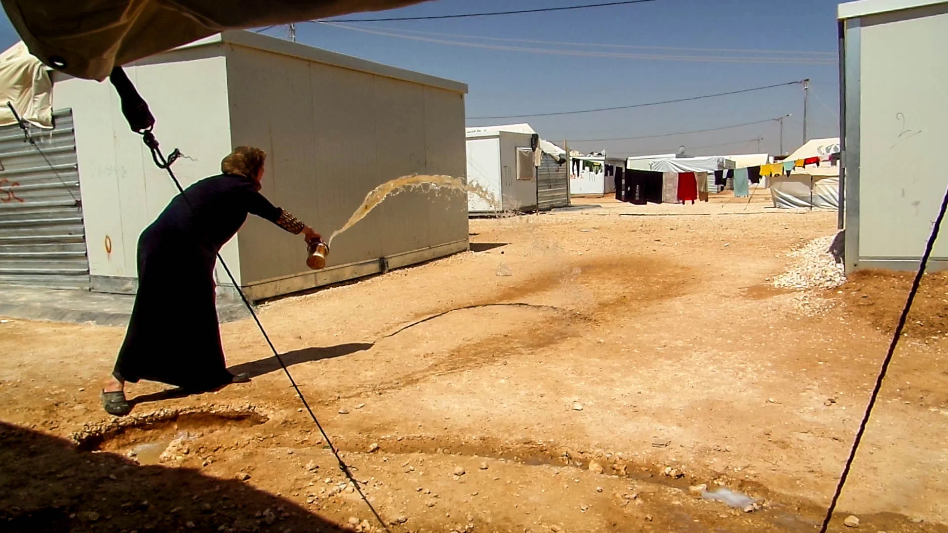 _19_khaldiya.momthrowingwater.jpg