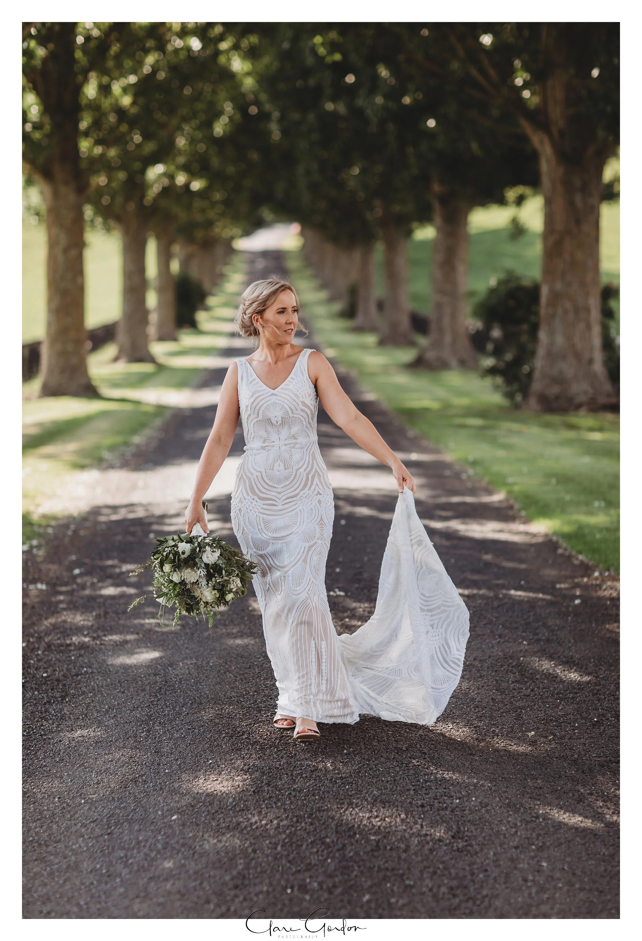 Red Barn-Wedding-Waikato-wedding-Bride-portrait-on-driveway (79).jpg