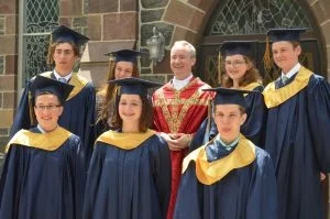 2018-Graduates-w-FrDaniel-300x199.jpg