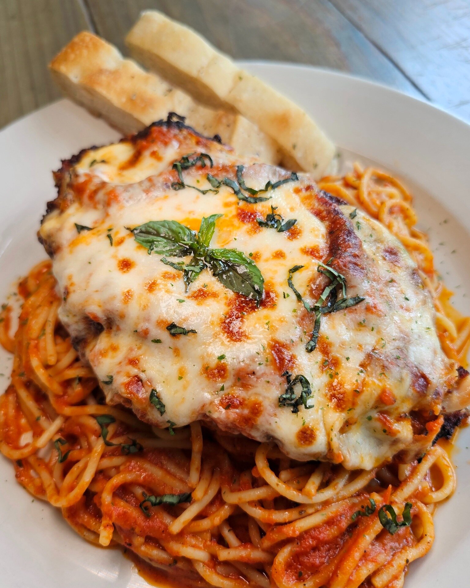 Arte's Chicken Parmigiana is one of our most popular menu items! We start with a tenderized chicken breast that is hand breaded and pan fried, and then covered in marinara, mozzarella, and served with spaghetti or fresh vegetables. Perfect for lunch 