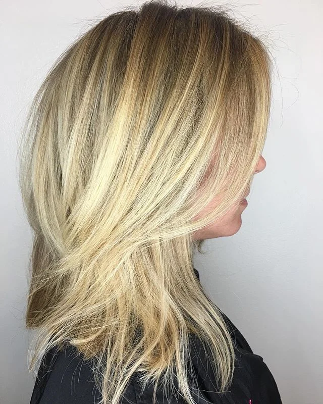 This guest used to live, work, and play at the Beach. She naturally has a level 5/6 hair and used to get it heavily highlighted often. She wanted to stop highlighting hair so often due to damage because of overlapping with bleach, but still wanted to