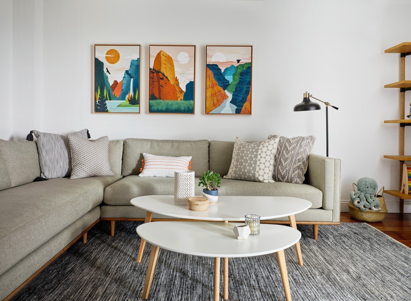 We love the striking contrast of this bold and colorful triptych of our client&rsquo;s favorite National Parks by @laura_aimss via @etsy in our otherwise neutral #NoeValleyViewsForDays living area.⁠
⁠
Photography Credit: @rbradleyphoto