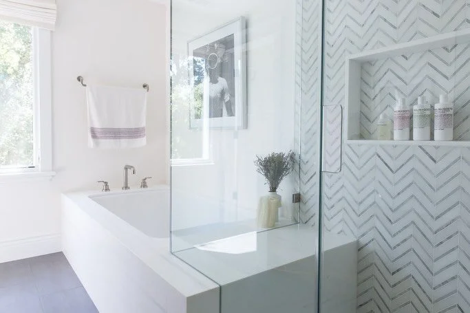 This picture illustrates two of our favorite aspects of the primary bath at our #calistogavactionhome projects. The handle cut out and integrated bench. Our client was adamant that there be a bench in the shower, so when we designed the tub area we e