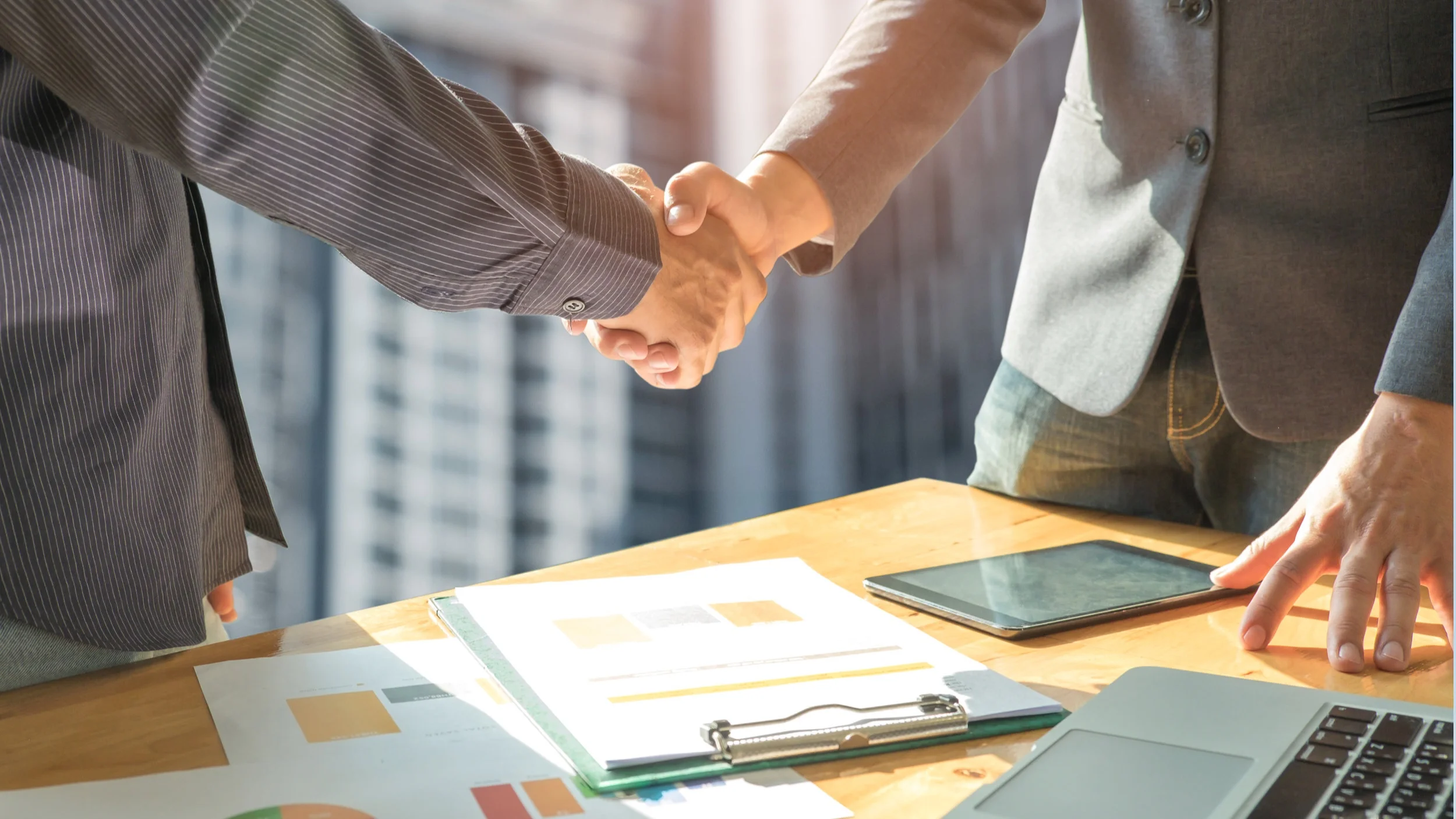 business-concept-two-men-shake-hands-with-P2DZLE6.jpg