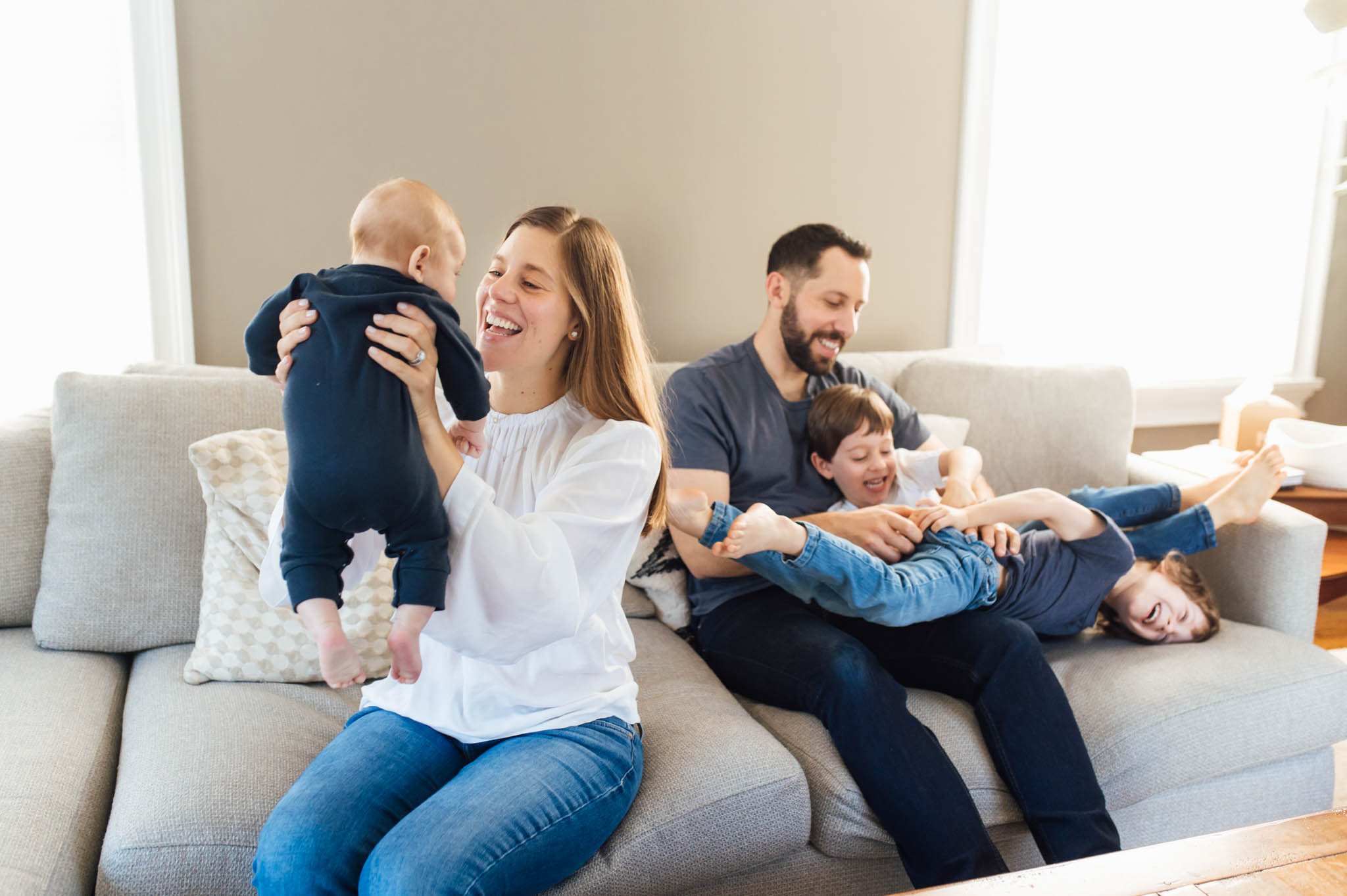 Family of 5 wrestles on the couch