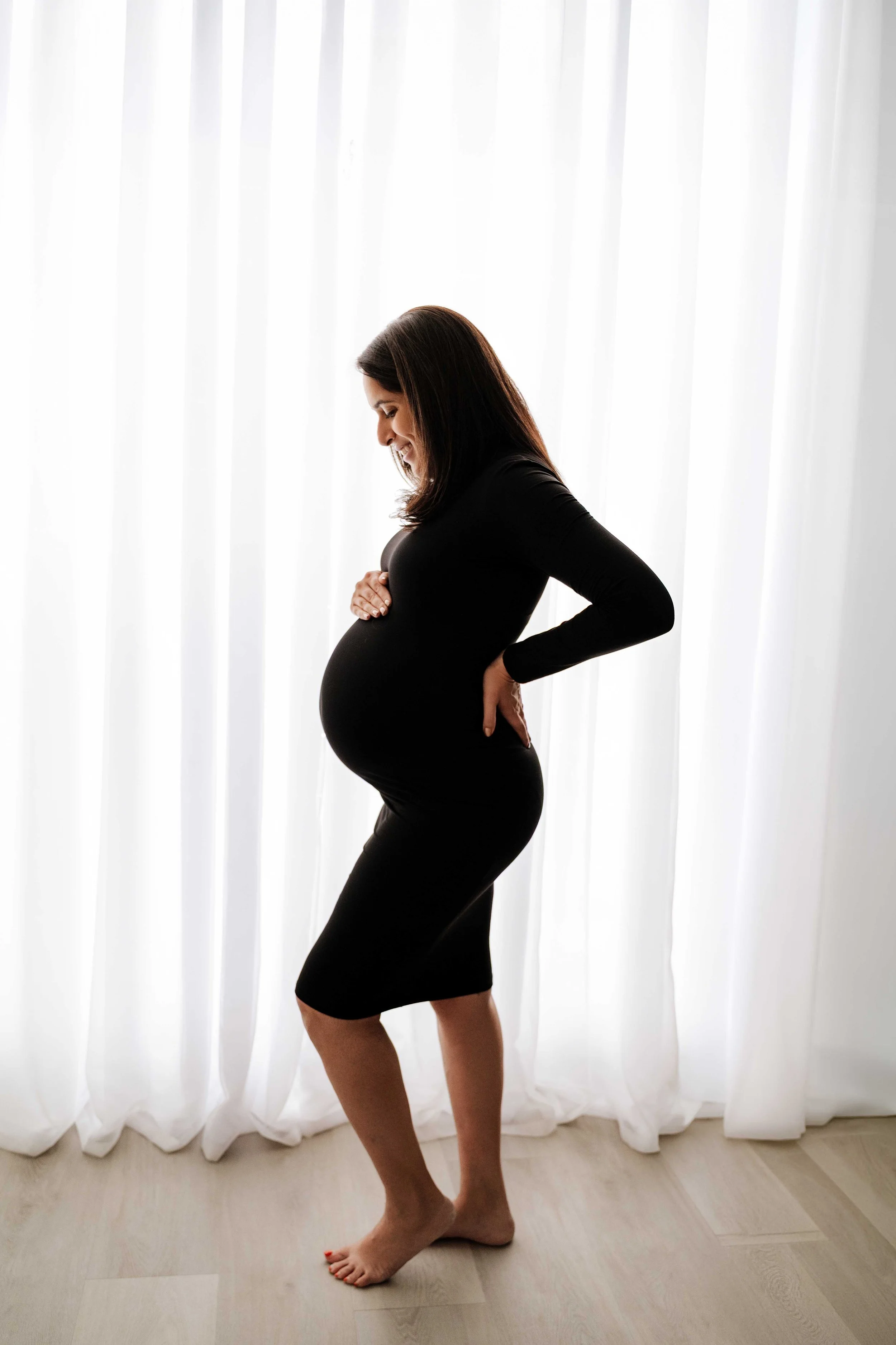 Studio-provided black dress maternity portrait, Westchester, NY