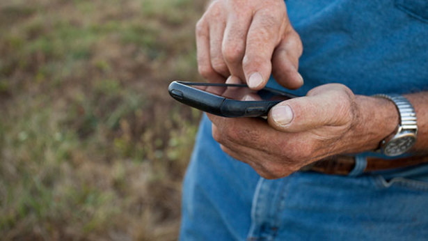farmer hands with phone.jpg