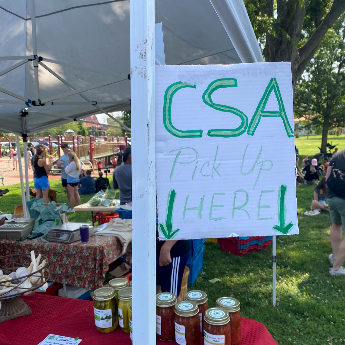 A farmers market with a CSA pickup station