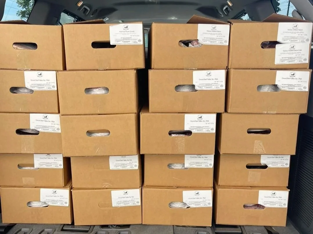 A minivan packed with boxes for direct to consumer delivery, illustrating the effort of managing farm deliveries on your own.