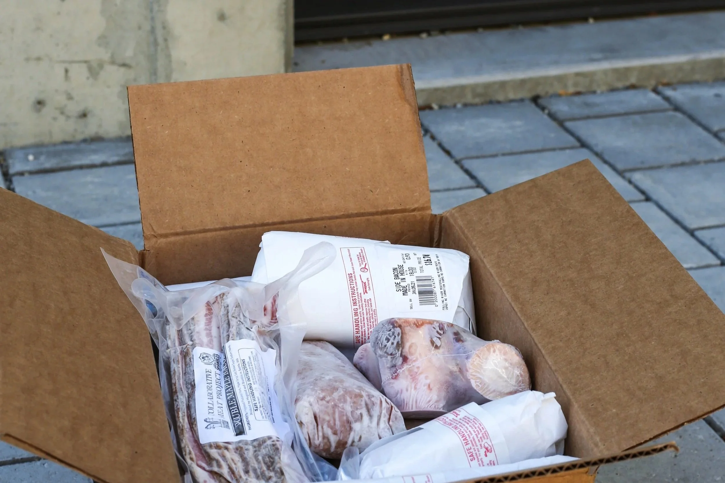 Box of farm fresh meat delivered directly to the buyers doorstep