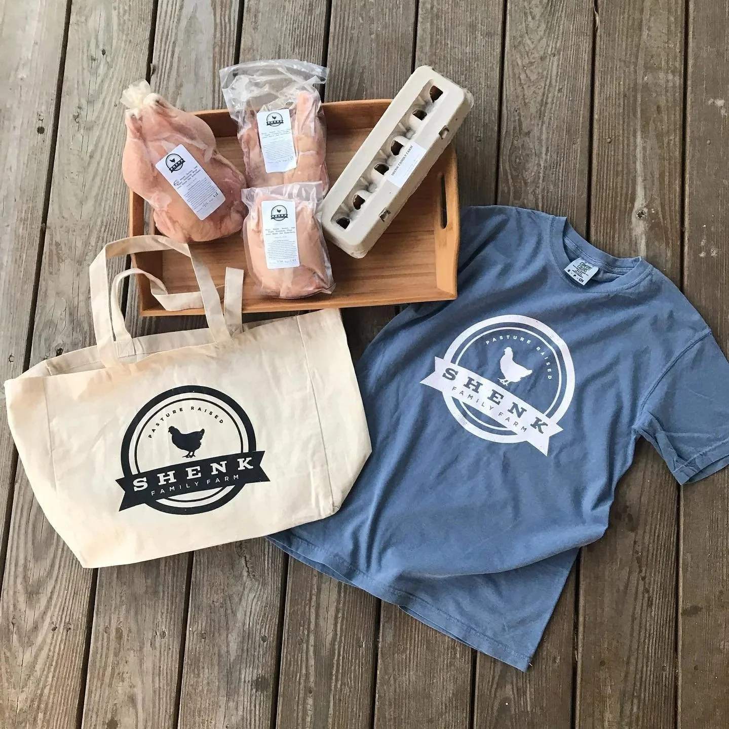 A bundle box from a local farm with branded merchandise