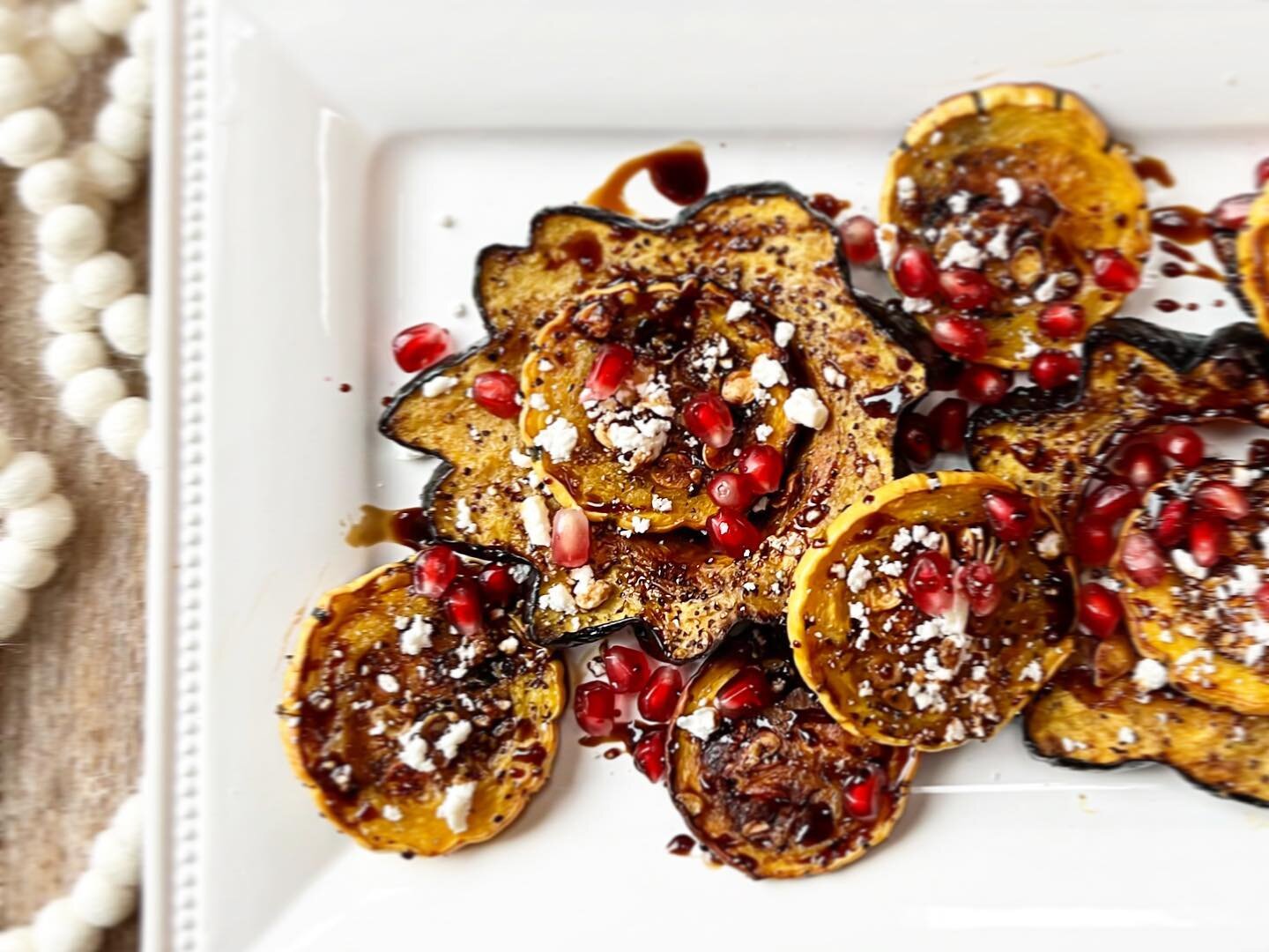 Wanna make something beautiful, yummy and seasonal as well as pretty darn easy? Perfect side dish right here-roasted delicata and acorn squash with crumbled goat cheese, good balsamic (the nice thick sweet stuff) and pomegranate seeds. All this take