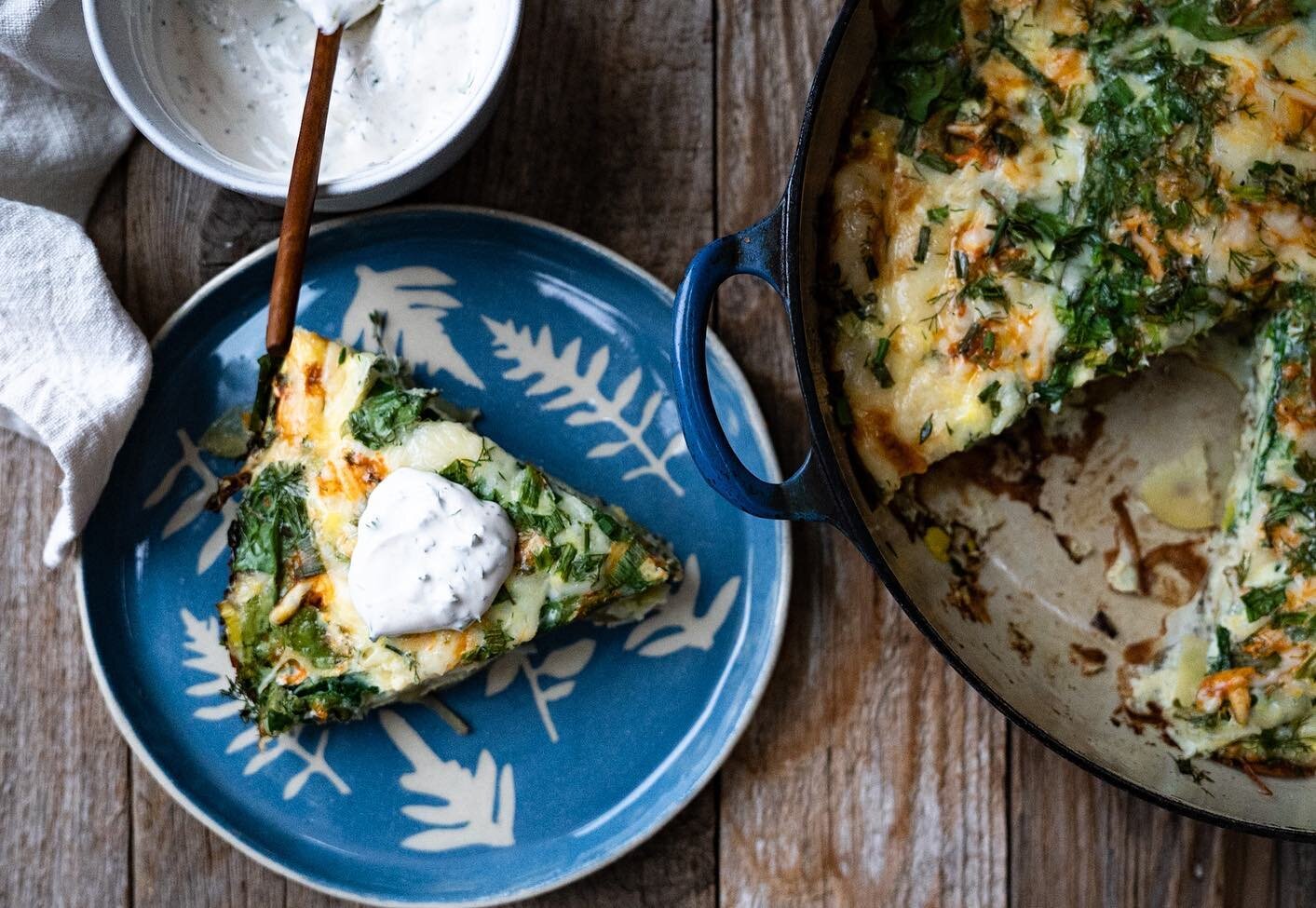 It’s been a bit.
Football Sunday frittata(ish). This little cutie is sautéed onion,leeks and garlic layered with thin sliced Yukon gold potatoes, fresh spinach, herbs-lots of herbs-dill, thyme, chives and rosemary all fresh and chopped,