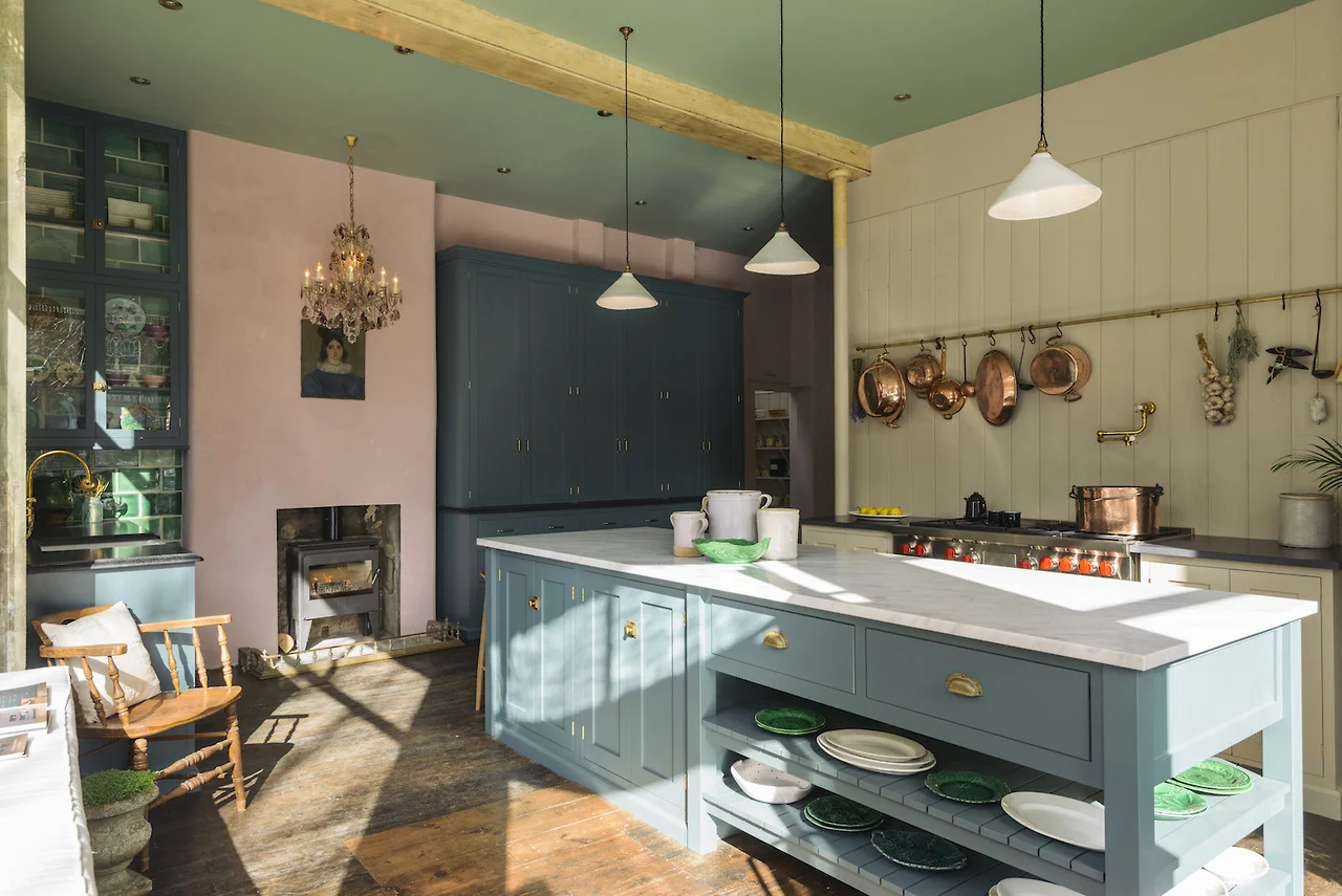 I absolutely love Devol Kitchens and this one is probably my favourite. The kitchen cabinets might be a fairly neutral blue but the green tiles and pink wall make this such a happy colourful place.