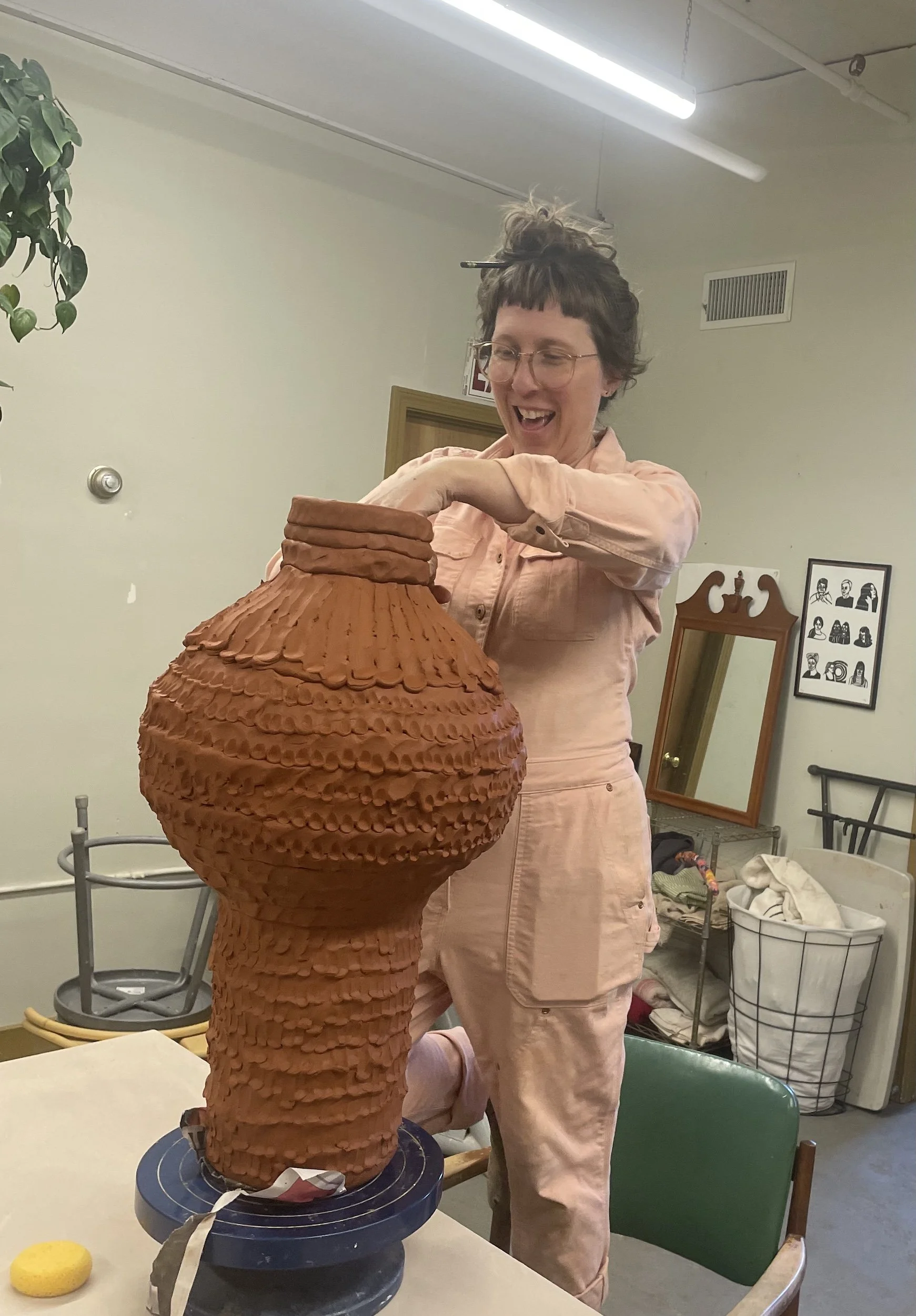 Meghan Samson handbuilding a sculpture