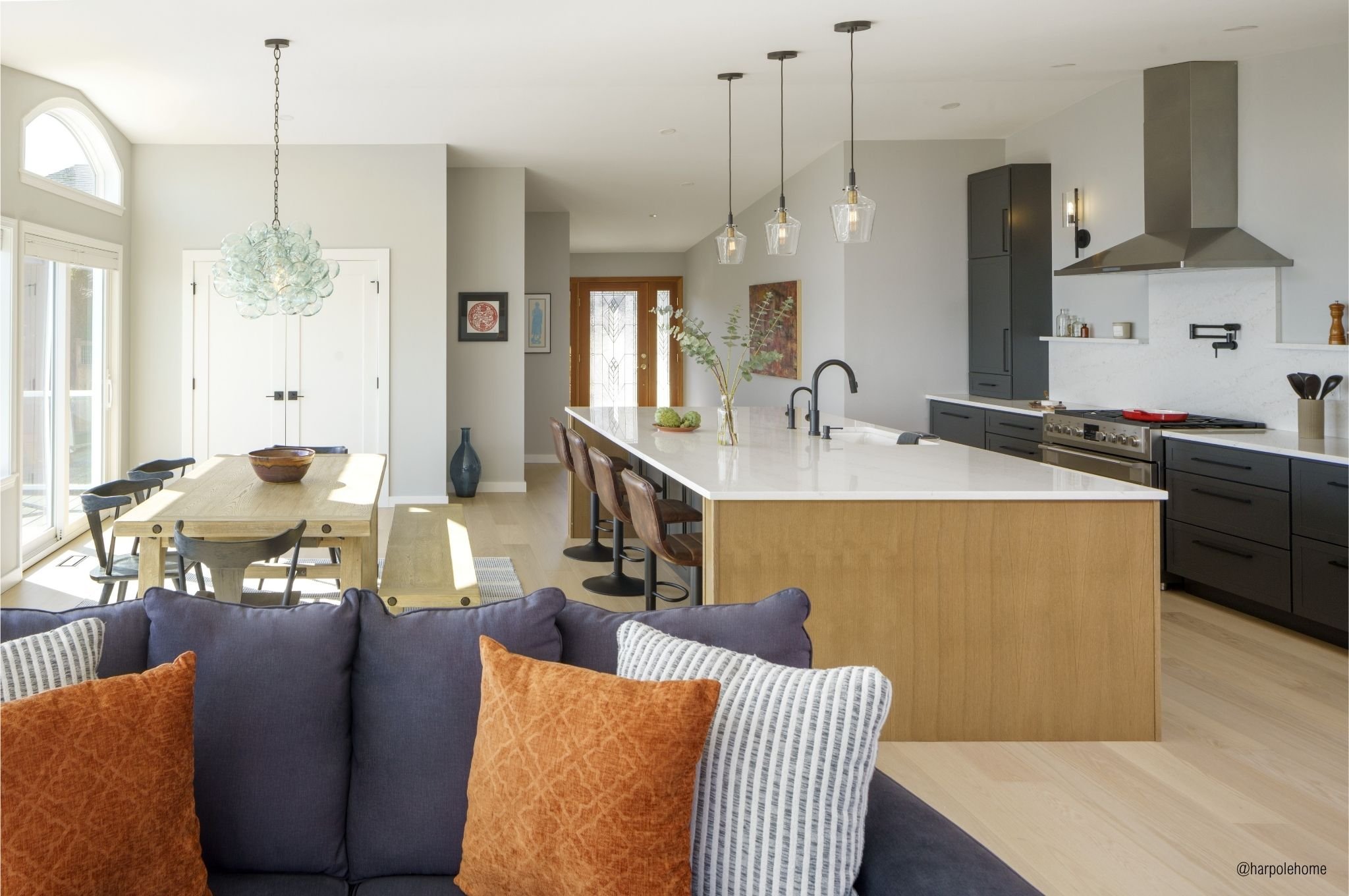 Vashon Island open plan kitchen, dining, and living area remodel with Durasupreme cabinetry and Puget Sound views