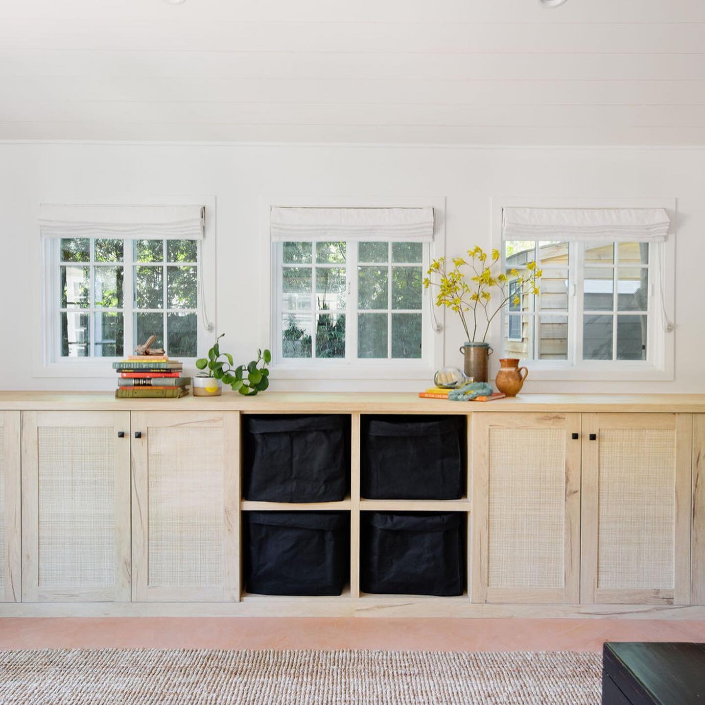 Storage &bull; Built-ins with cane inset. My favorite paper bags folded in cubbies for toy storage. Photo @hylahhedgepeth Contractor @newgenerationimprovements Design @abbyguild #adu #garageremodel #caning #cabinets #storageideas #garageconversion #b