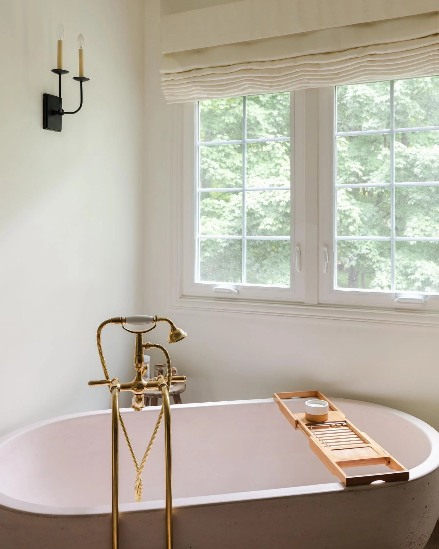 Custom stained concrete tub and unlacquered brass freestanding tub filler. A respite from chilly fall days.  Design: @abbyguild Photo: @katehorganphoto &bull;

&bull;

&bull;

#designinspo #interiorinspo #interiordesigner #interiordesign #interiordec