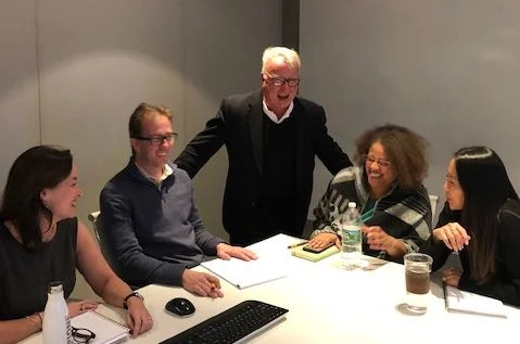 Joe working with a happy team