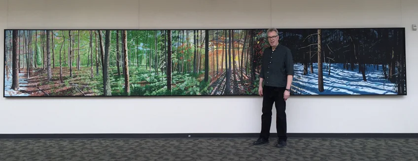 Charlie Yoder in front of his acrylic and oil painting, Four Play , 2016, 4’ x 24’