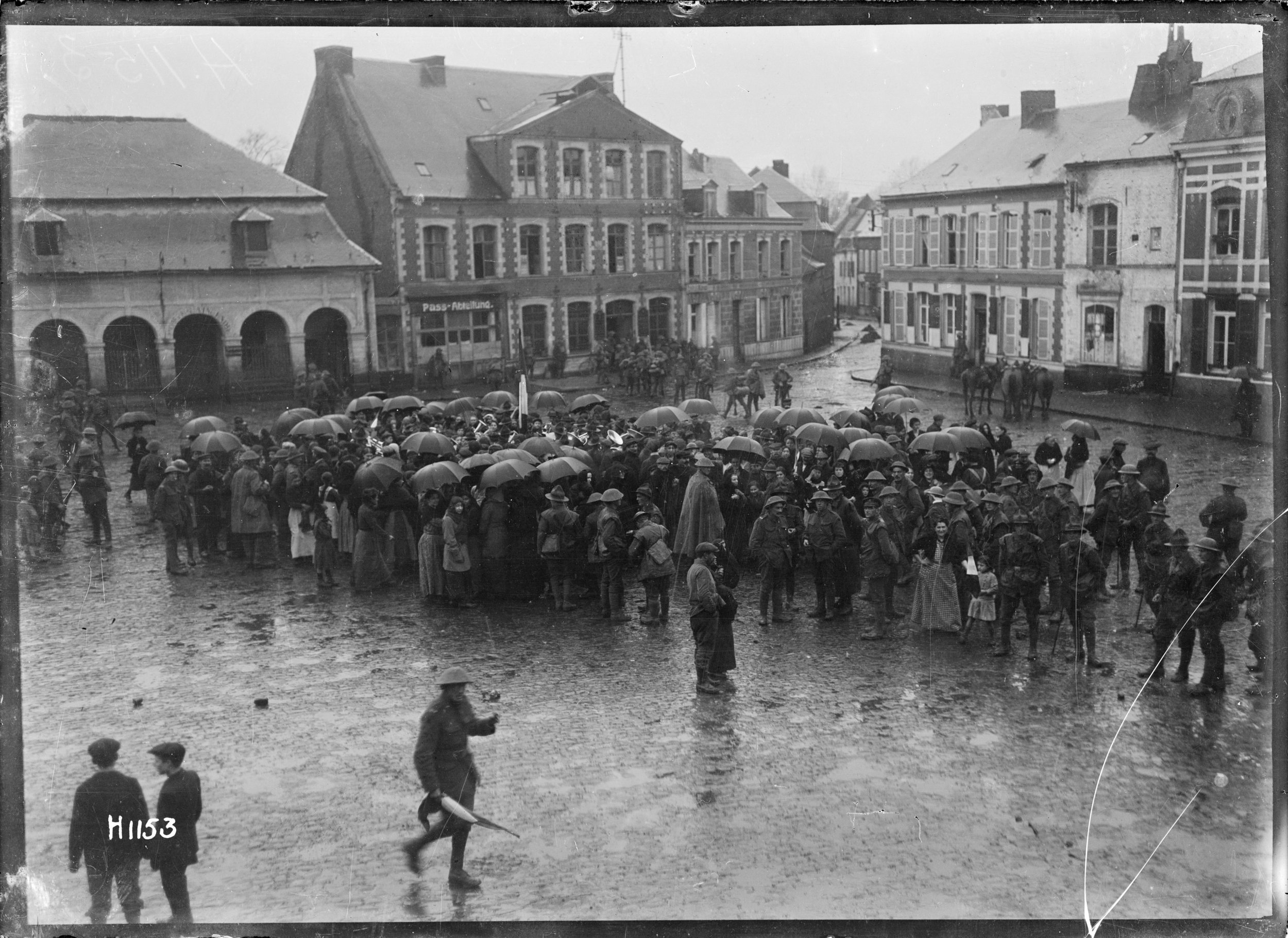 A New Zealand regimental band plays to a crowd in Le Quesnoy, the day after the town’s liberation. Photographer: Henry Armytage Sanders. Royal New Zealand Returned and Services' Association Collection, Alexander Turnbull Library, Wellington, New Zea…