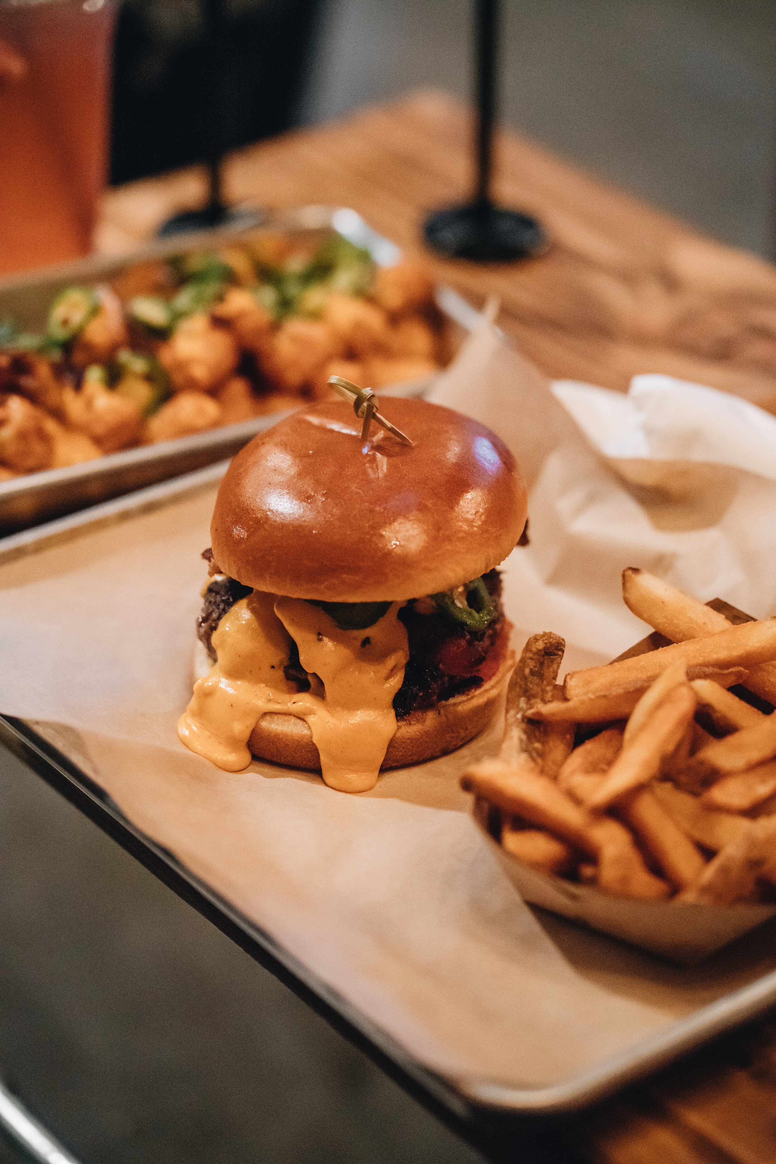  Lucky Luke Brewpub’s pub house burger with fries and a side of totchos  