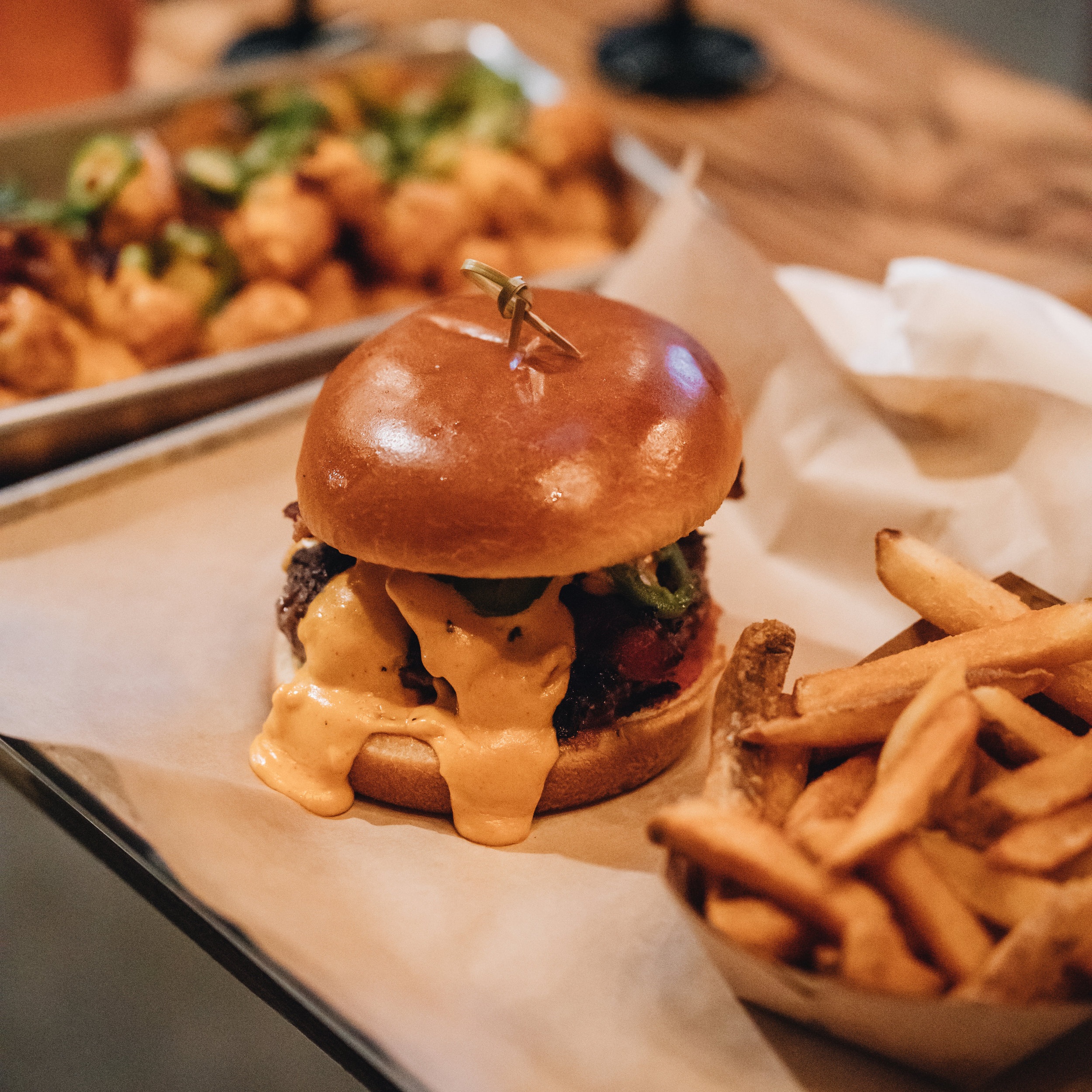  Lucky Luke Brewpub’s Pub house burger with fries and a side of totchos  