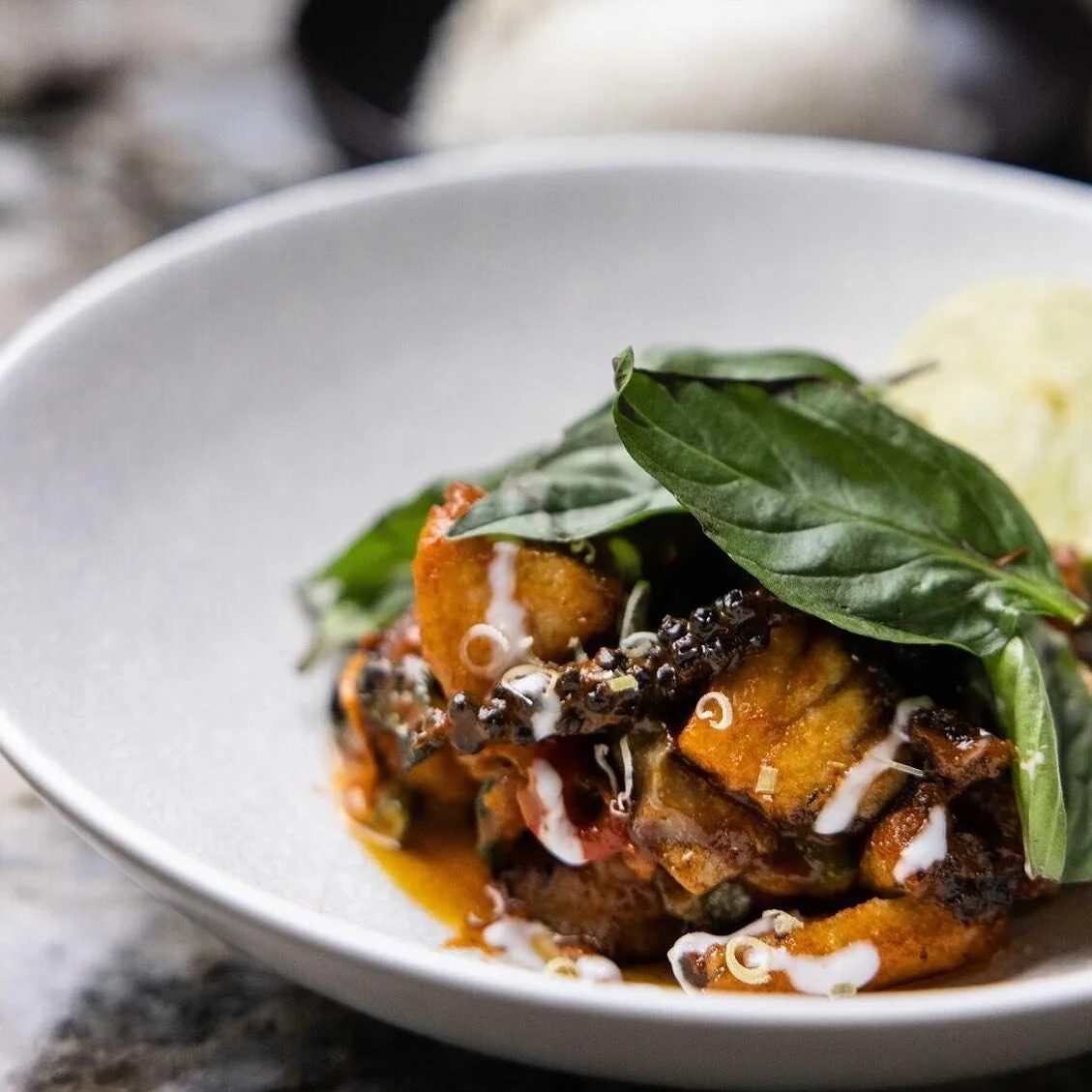 DRY RED CURRY
crispy tried barramundi w spicy red curry
paste w krachai, kaffir lime &amp; Thai basil