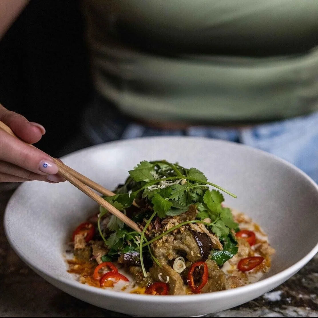 EGGPLANT KAI LAN - Roast eggplant w king mushrooms &amp; kai lan in
soy &amp; sesame coconut broth