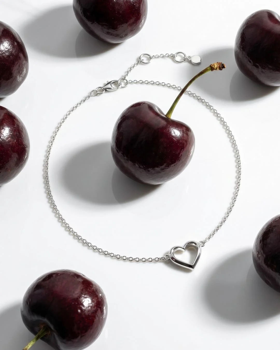 Love_Silver_Heart_Fine_Outline_Mini_Bracelet_on_styled_background.jpg