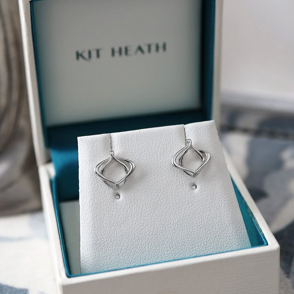 Alicia_Petite_Stud_Earrings_on_styled_background.jpg