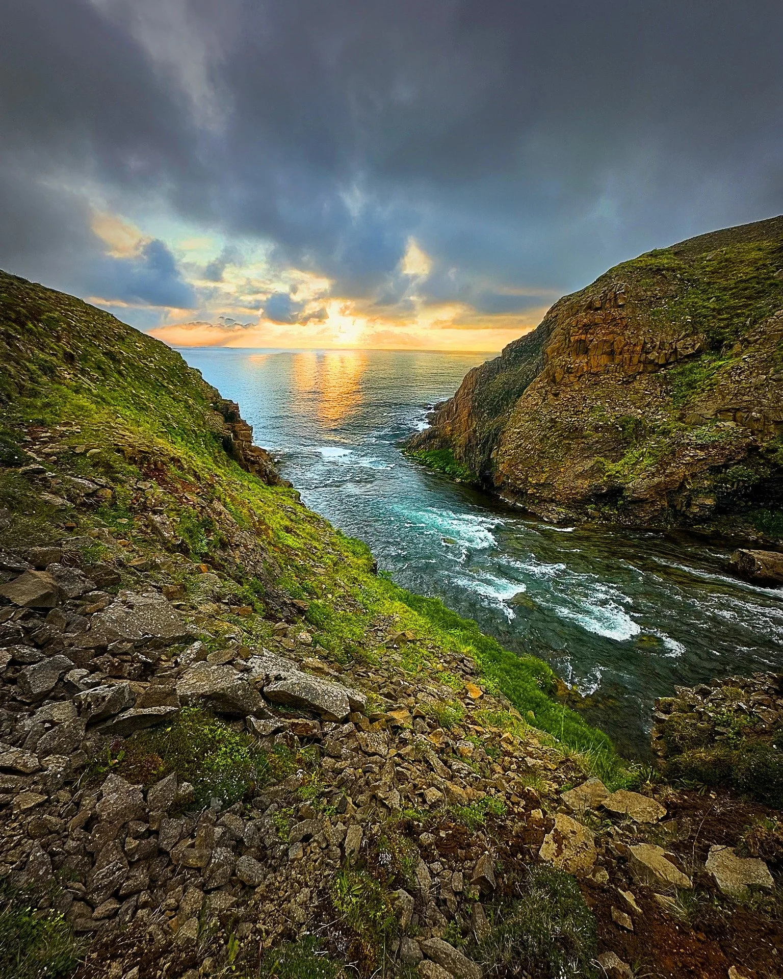 When the river meets the ocean and the sky catches fire &mdash; Iceland does not disappoint. Some places are too beautiful to be real... but here we are. 🌅🇮🇸
 #reykjavik #reykjavikraincoats #iceland #rain