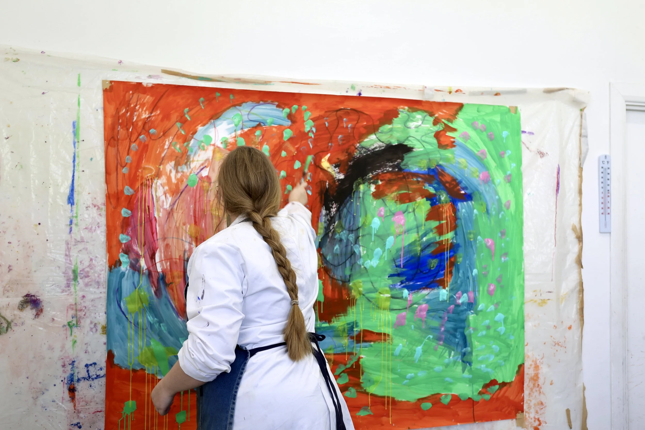 Kimberly painting in the studio