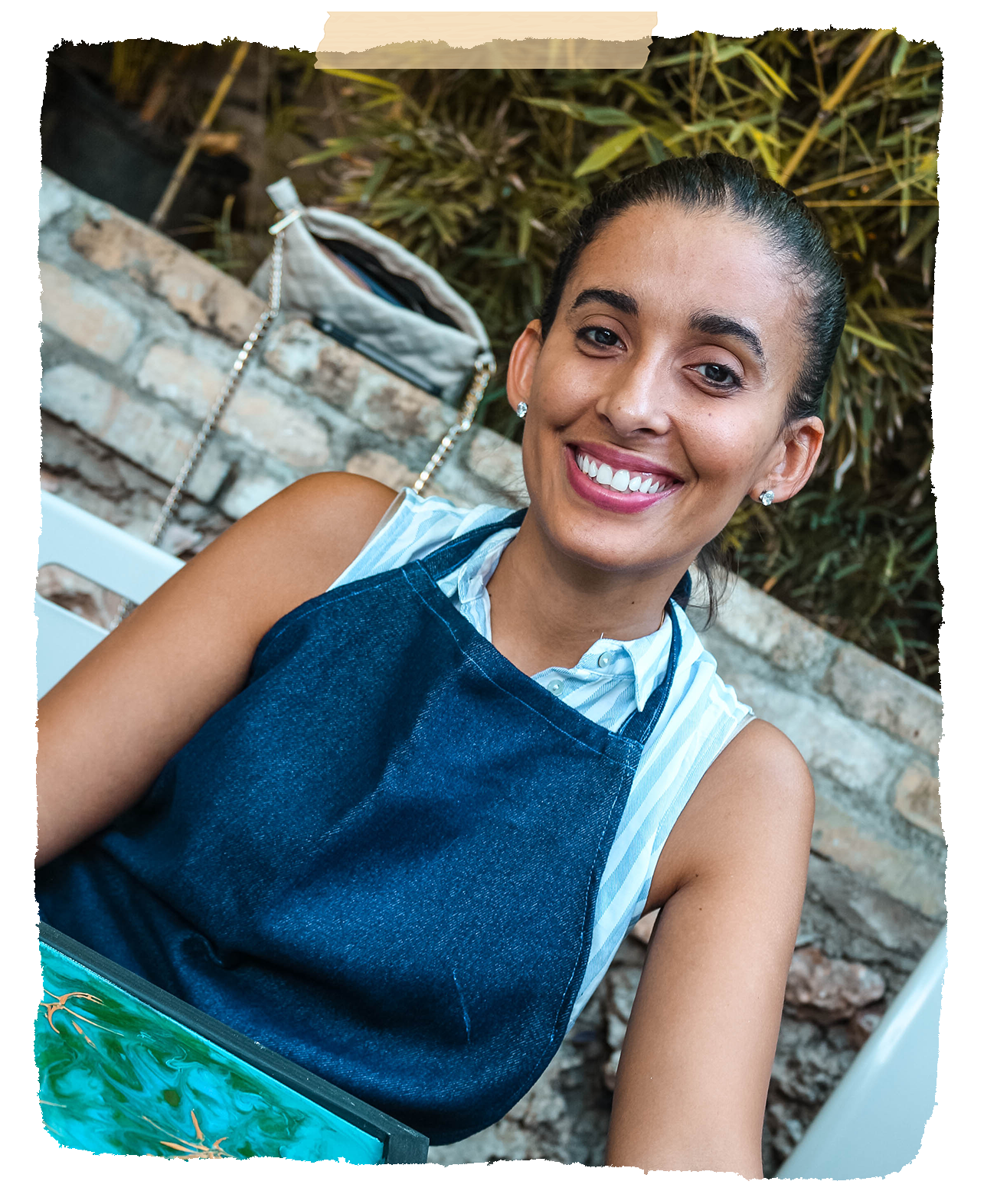 Creative resin workshop participant, Sarah, is all smiles in Haiti.