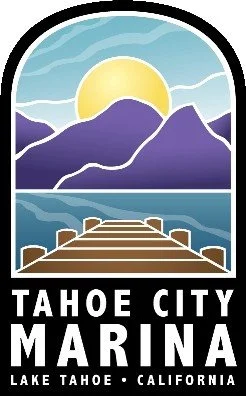 Sunrise over mountains viewed from a pier at Tahoe City Marina, Lake Tahoe, California.