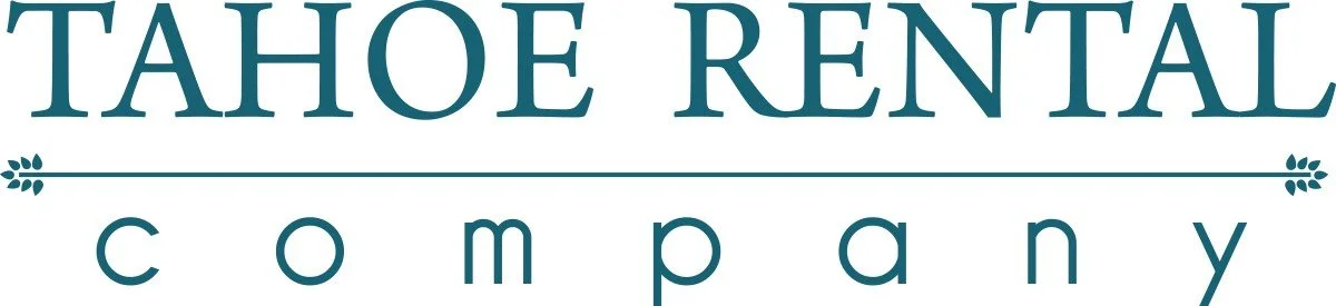 Logo for Tahoe Rental Company with stylized line and four-leaf clover