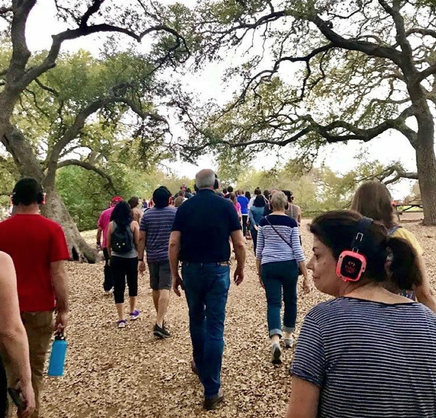 A view of those who follow in Alexandra Chaves’ footsteps as she embarks on her MindTravel SilentHikejourney with composer Murray Hidary as the main guide at the Lady Bird Johnson Wildflower Center. [Courtesy of Alexandra Chaves]