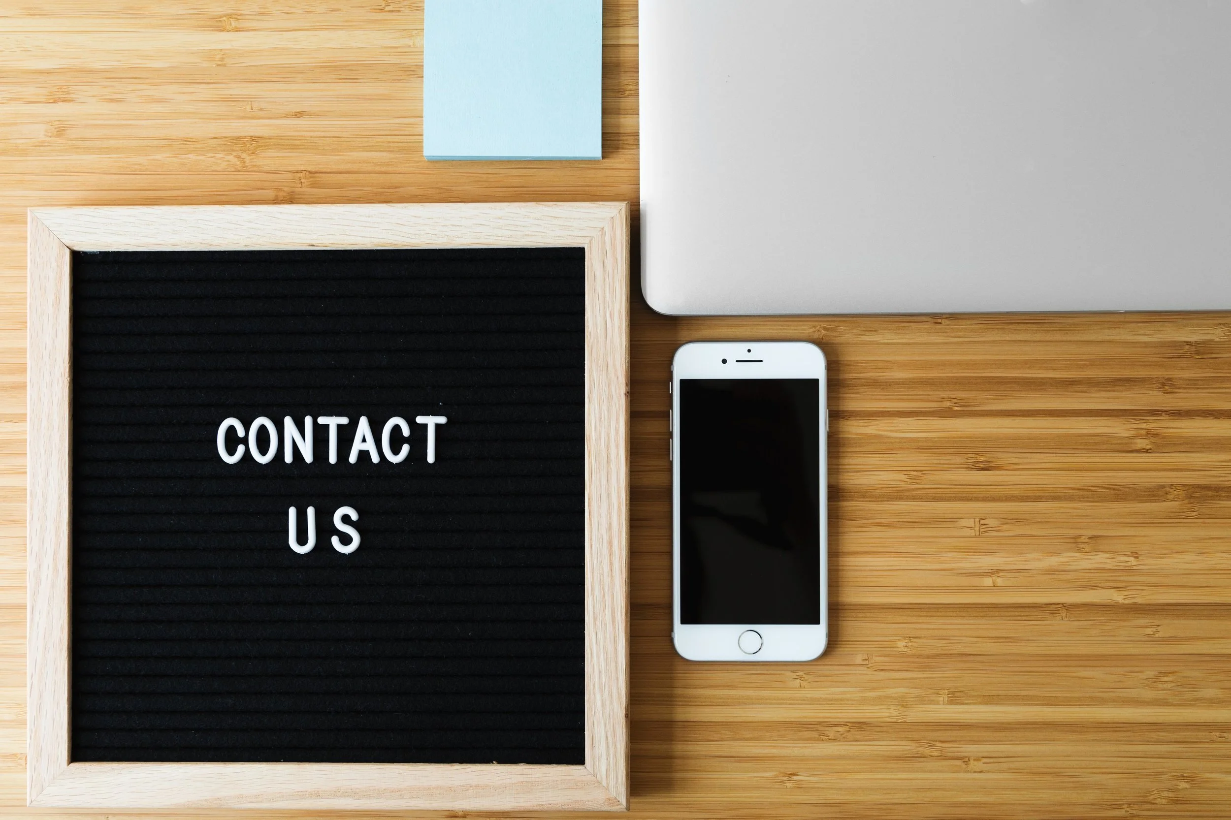 contact-us-sign-with-phone-computer-on-desk_integrated-brain-and-spine-center-for-functional-neurology-and-medicine_integrated-physicians-medical-group-west-los-angeles-chiropractic-practice.jpg